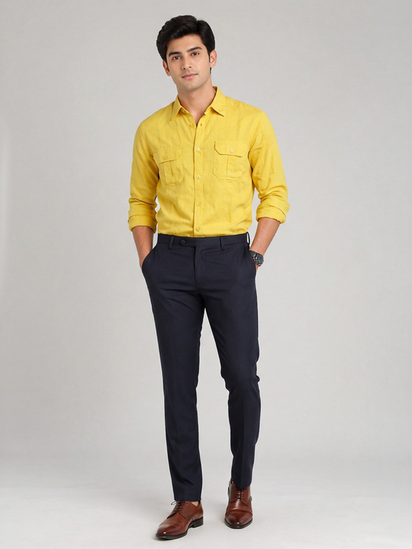 Man wearing Allen Solly yellow 100% linen casual shirt tucked into navy trousers for a smart casual look.